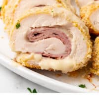 sliced chicken cordon bleu on a platter with recipe name at the bottom