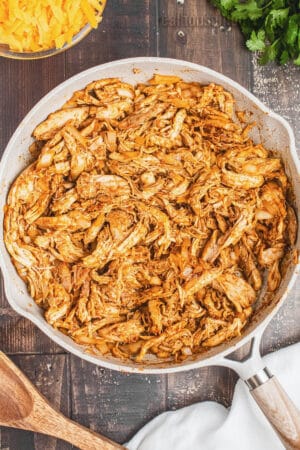 cooked taco seasoned chicken and onion in a skillet