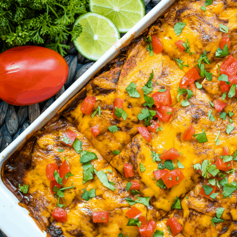Easy Chicken Enchilada Casserole is packed with layers of tasty ingredients. Treat your family to this delicious meal and it'll quickly become a fan favorite!