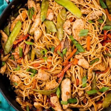 square image of chicken lo mein in a skillet