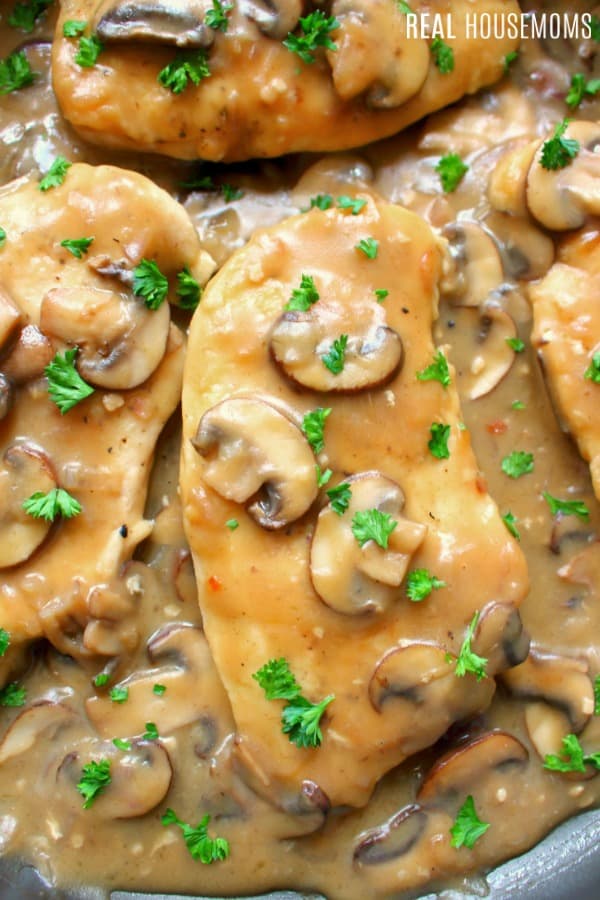 closeup of chicken marsala garnished with parsley