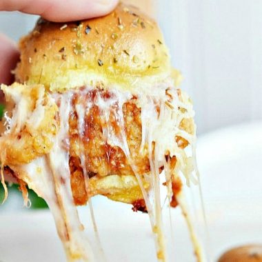 These Chicken Parmesan Sliders are an easy recipe made with fried chicken tenders, tomato sauce, and lots of cheese!