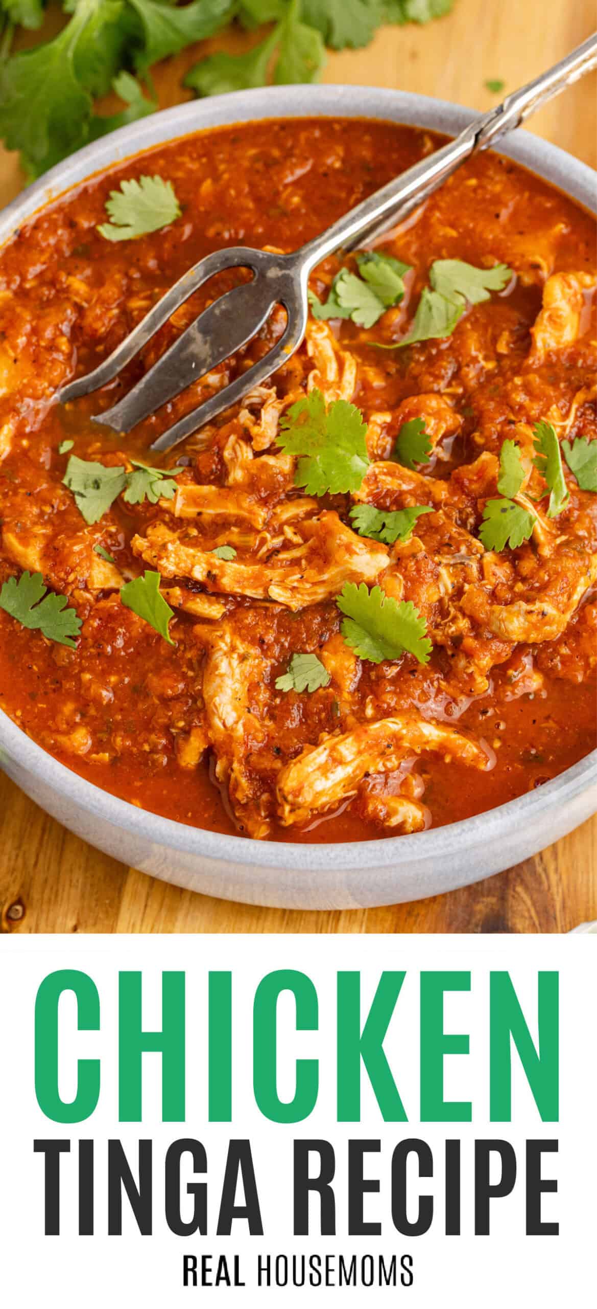 chicken tinga in a serving bowl topped with cilantro with recipe name at the bottom