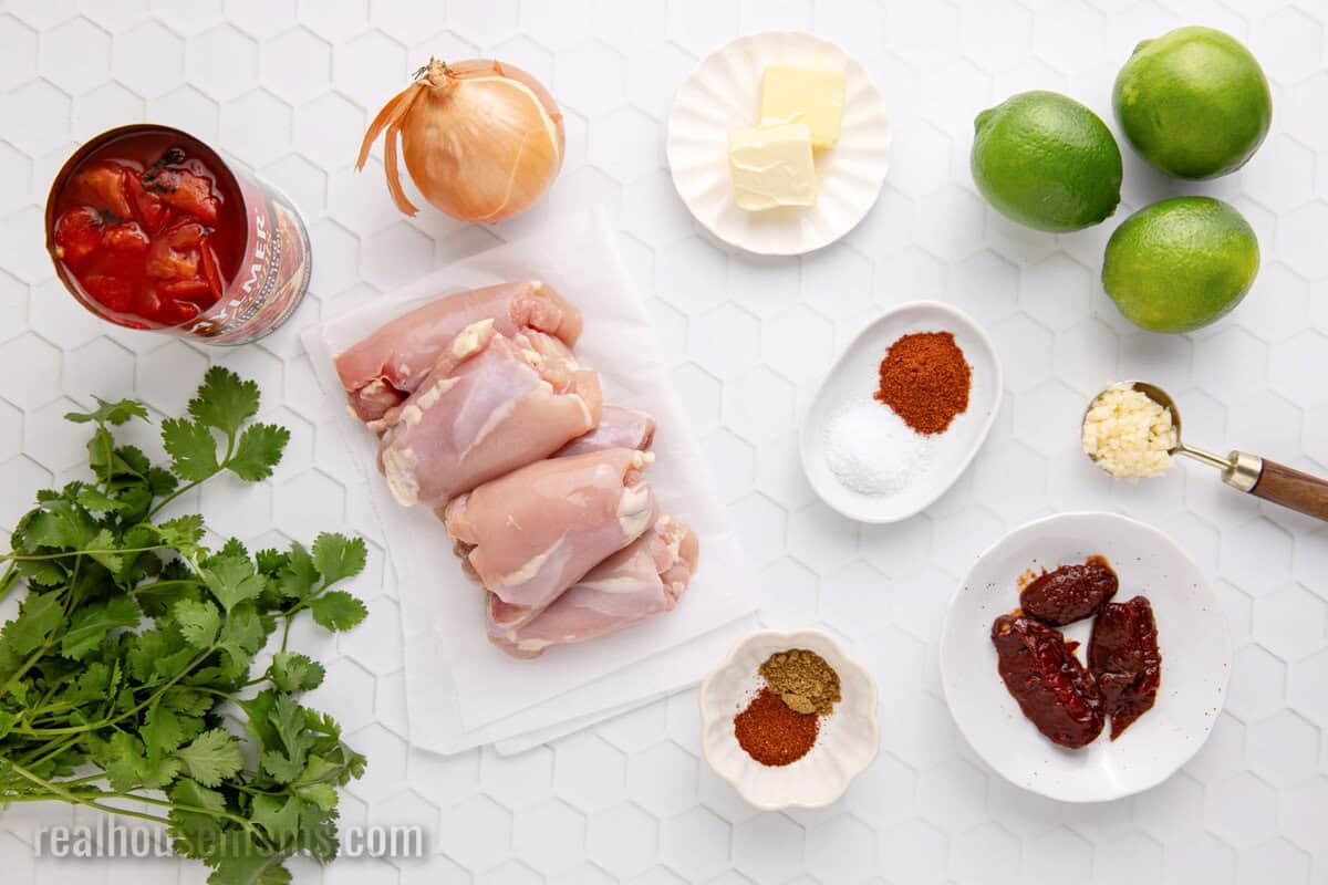 ingredients to make chicken tinga laid out on a counter