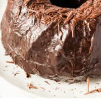 chocolate bundt cake with chocolate shaving on top with recipe name at the bottom