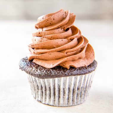 This simple, delightfully fluffy Chocolate Buttercream Frosting is the only recipe you'll ever need for all of your cakes, cupcakes, and baked goods!