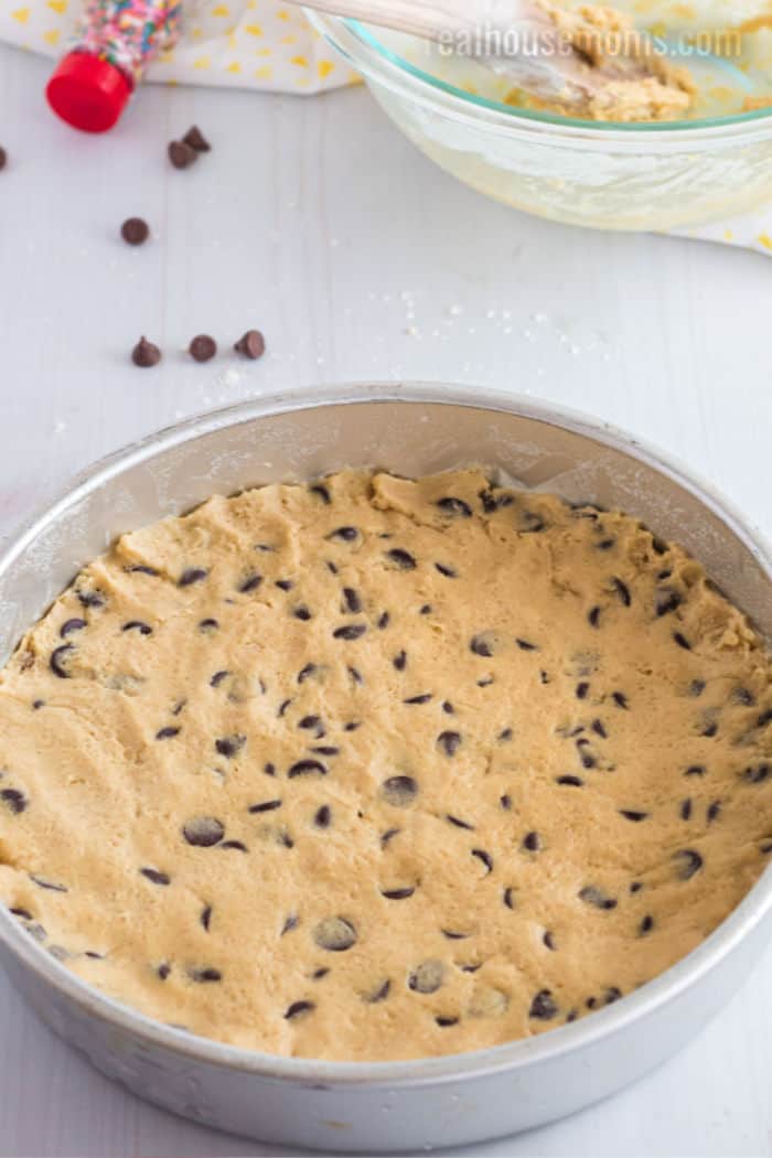cookie dough pressed into a cake pan