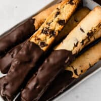 square image of chocolate chip and peppermint biscotti piled up on a platter