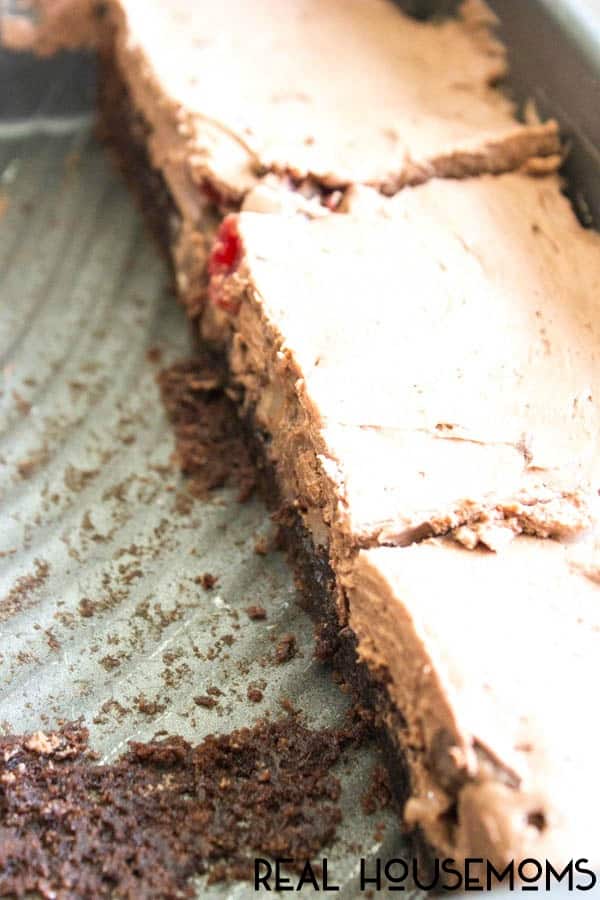 Chocolate Covered Cherry Cheesecake Brownie Bars are decadently delicious. A no-bake cheesecake with a fudgy brownie base these bars are a real crowd pleaser!