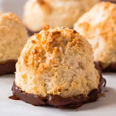 square close up of image of a chocolate dipped coconut macaroon