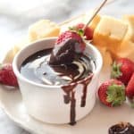 Silky warm Chocolate Fondue is a crowd-pleasing dessert you can serve in individual pots for an elegant finish your dinner party!