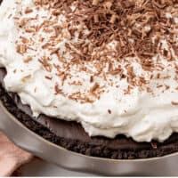 angled view of a whole chocolate pudding pie in the pie plate with recipe name at the bottom