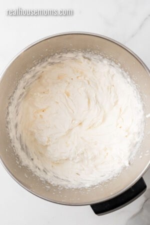 homemade whipped cream in a sand mixer bowl