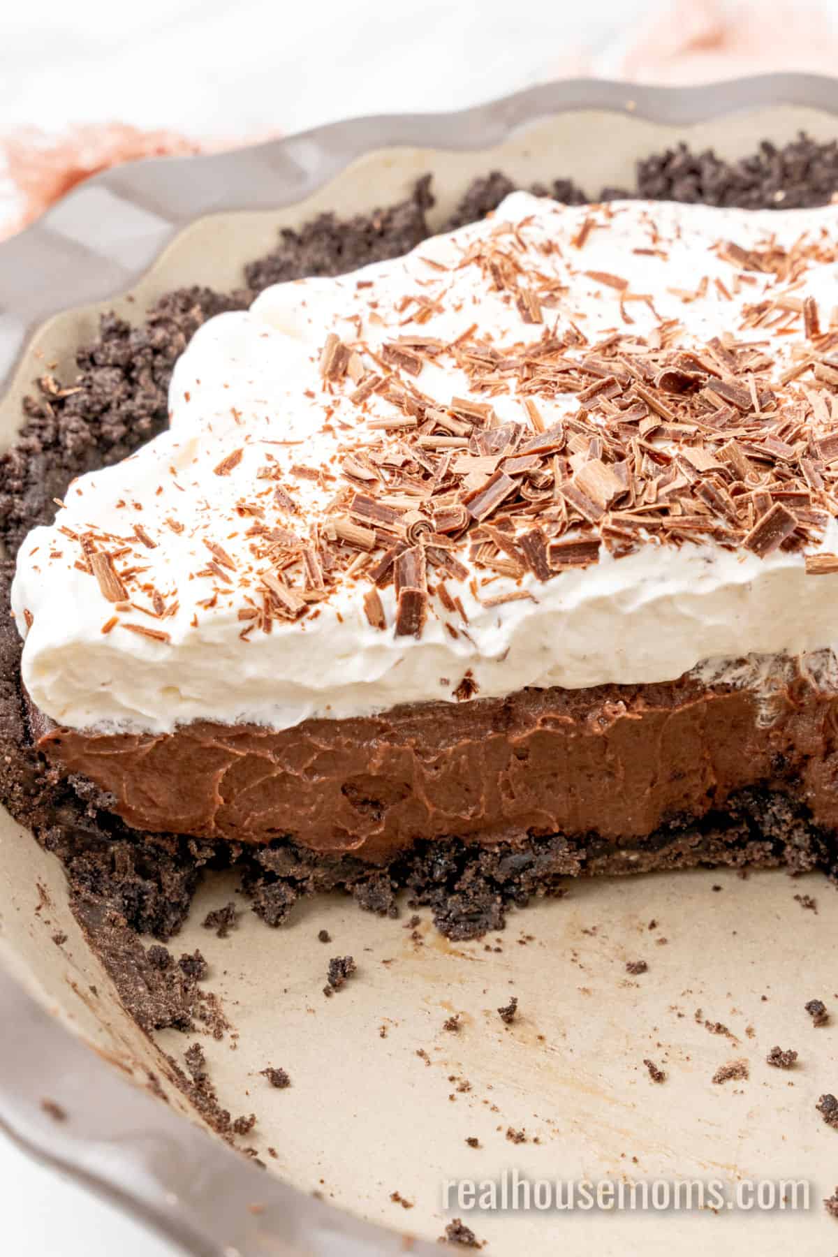 chocolate pudding pie with a portion taken out to show the layers
