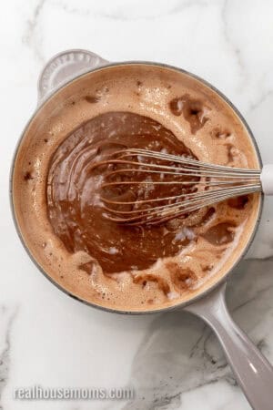 whisk in a saucepan with chocolate pudding base that's been simmering