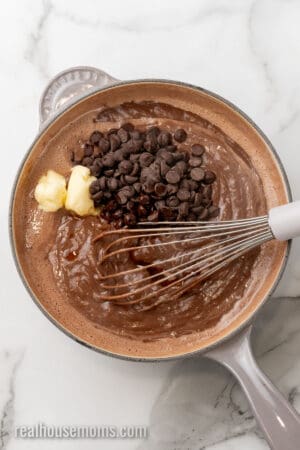 butter, chocolate chips, and vanilla added to cooked chocolate pudding base in a saucepan