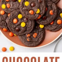 looking down at chocolate reese's piece cake mix cookies on a plate with recipe name at the bottom