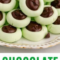 chocolate thumbprint cream cheese mints piled on a plate with recipe name at the bottom