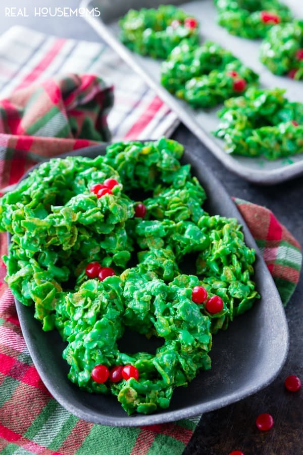 Christmas Wreath Cookies are a festive, fun, and tasty Christmas dessert. These cornflake wreaths are fun to make & easy enough that kids can help too!