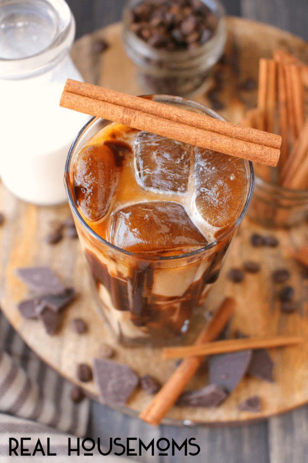 This amazing CINNAMON MOCHA ICED COFFEE is made with a deliciously simple cinnamon syrup, cold brew coffee, and topped off with chocolate syrup for an incredible drink that will be your new favorite way to start the day!