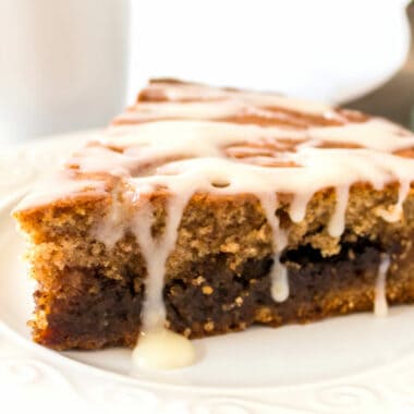 Cinnamon Roll Coffee Cake is the PERFECT sweet treat for breakfast or brunch! And that cream cheese glaze on top?! It'll be hard to say no to another piece!
