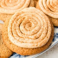 cinnamon roll sugar cookies on a plate with recipe name at the bottom