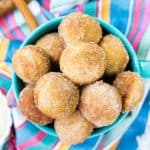 Cinnamon Sugar Donut Muffins are so easy to make at home! These baked breakfast bites are coated in butter, cinnamon, and sugar and taste like freshly fried donut holes!