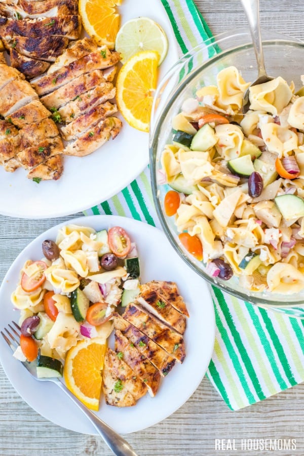 sliced grilled chicken with pasta salad