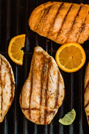 citrus marinated chicken breasts on a grill