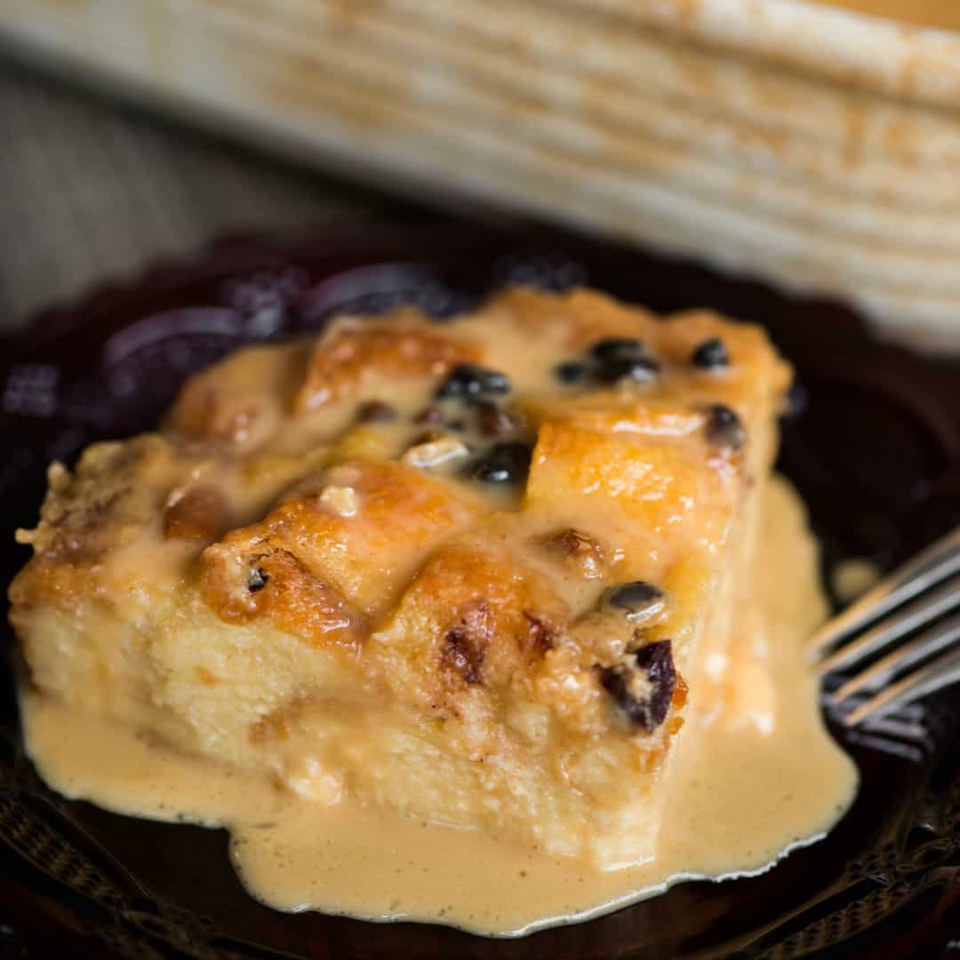 Classic Bread Pudding with Vanilla Caramel Sauce is a dessert not for the faint of heart. Made with soft challah bread, this sweet treat is a favorite!