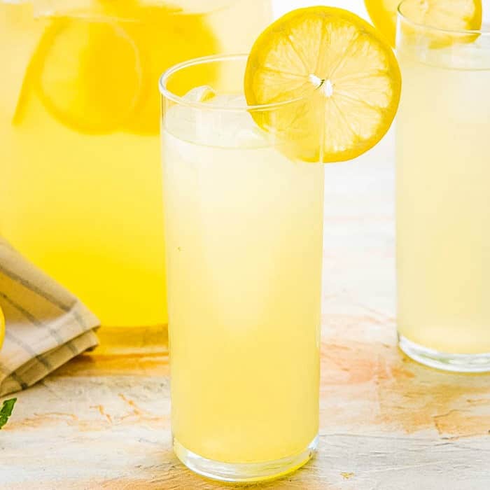 Classic Homemade Lemonade is the epitome of summer! Sweet, tart, and refreshing, it's perfect for lounging with friends on the porch, and backyard BBQs!