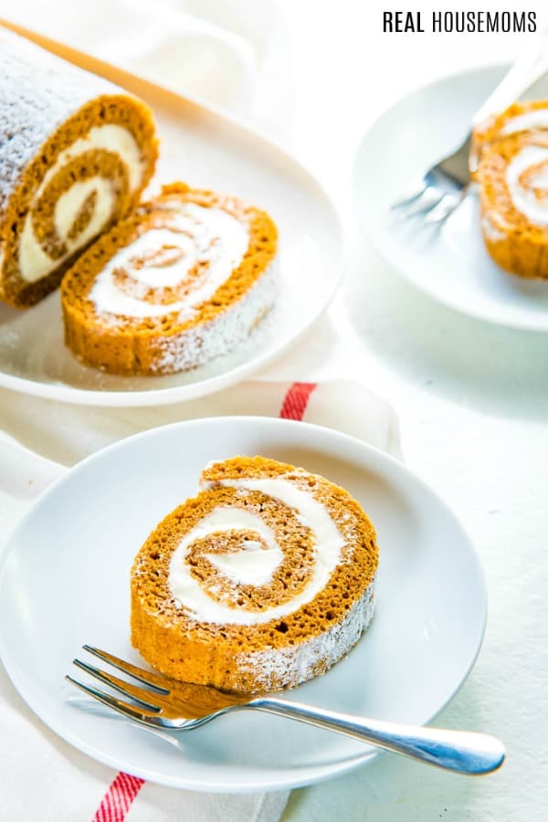pumpkin roll cake slices on plates