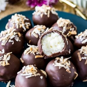 Sweet Coconut Cream Truffles made with just a few ingredients, cloaked in a dark chocolate shell, and topped off with toasted coconut!