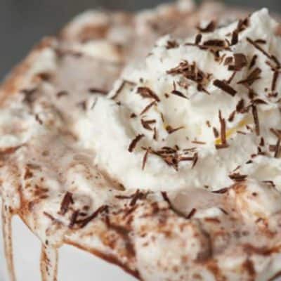 Rich and decadent Coconut Rum Hot Cocoa made from milk, half and half, chocolate, and coconut rum will warm your belly and put a smile on your face!