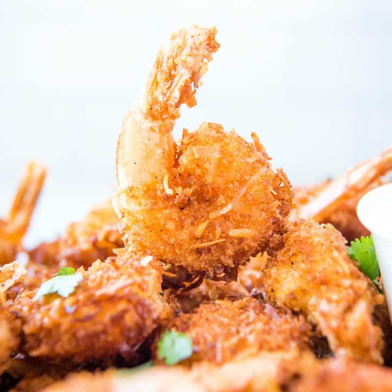 Crunchy Coconut Shrimp is always a crowd-pleasing appetizer! You're gonna love these juicy shrimp with a savory-sweet coconut crust & just a hint of heat!