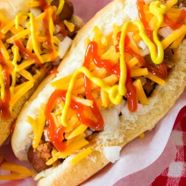Coney Island Hot Dogs are perfectly cooked and topped with tasty homemade hot dog chili. This recipe is about as close to authentic as you'll get!