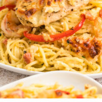 Copycat Olive Garden Chicken and Shrimp Carbonara on a plate with recipe name at the bottom