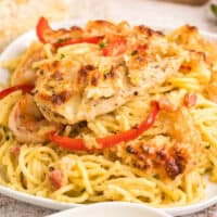 square close up image of Copycat Olive Garden Chicken and Shrimp Carbonara on a palte