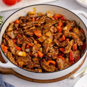 square image of a skillet of copycat panda express beijing beef