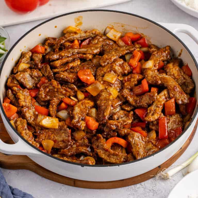 square image of a skillet of copycat panda express beijing beef