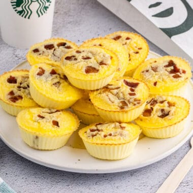 square image of copycat starbucks bacon & gruyere egg bites piled on a plate