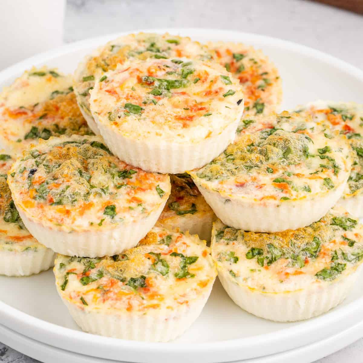 square image of copycat starbucks egg white & roasted red pepper egg bites piled on a plate