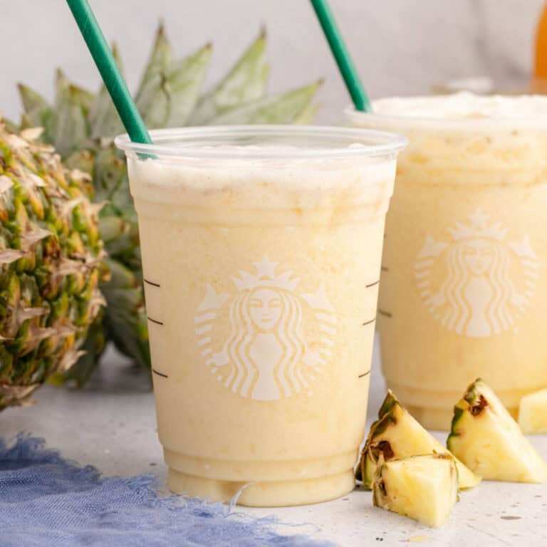 square image of copycat starbucks paradise drink in a starbucks cup with a green straw