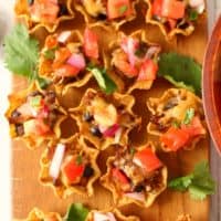 The perfect little nacho bite for every football party and home-gating event! Barbecue beef, beans, cheese and plenty of Pico de Gallo make these COWBOY NACHO BITES a fantastic appetizer everyone will love!