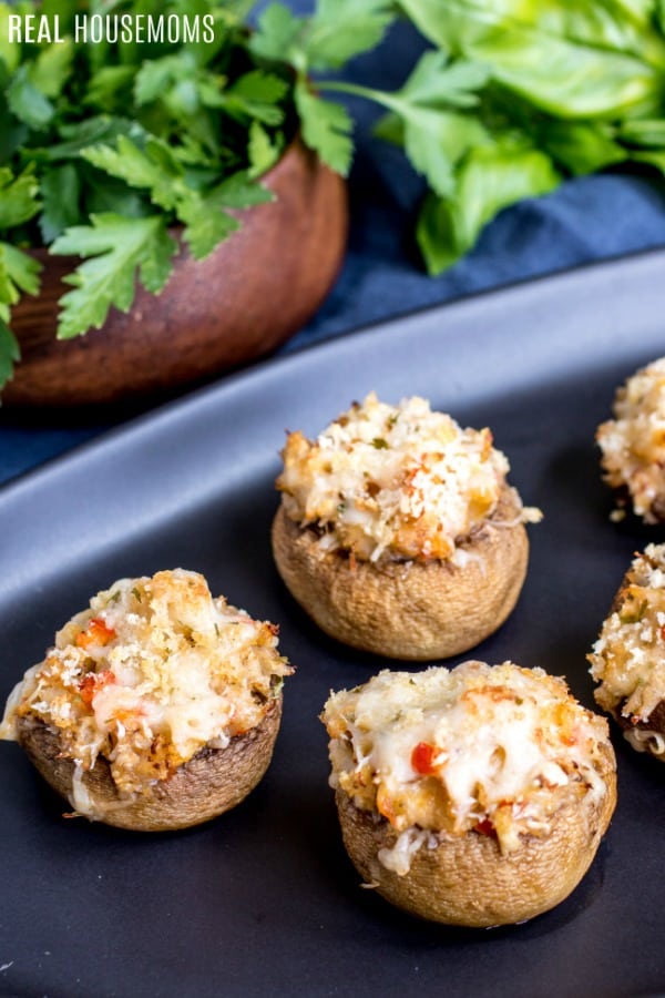 crab stuffed mushrooms on a serving platter