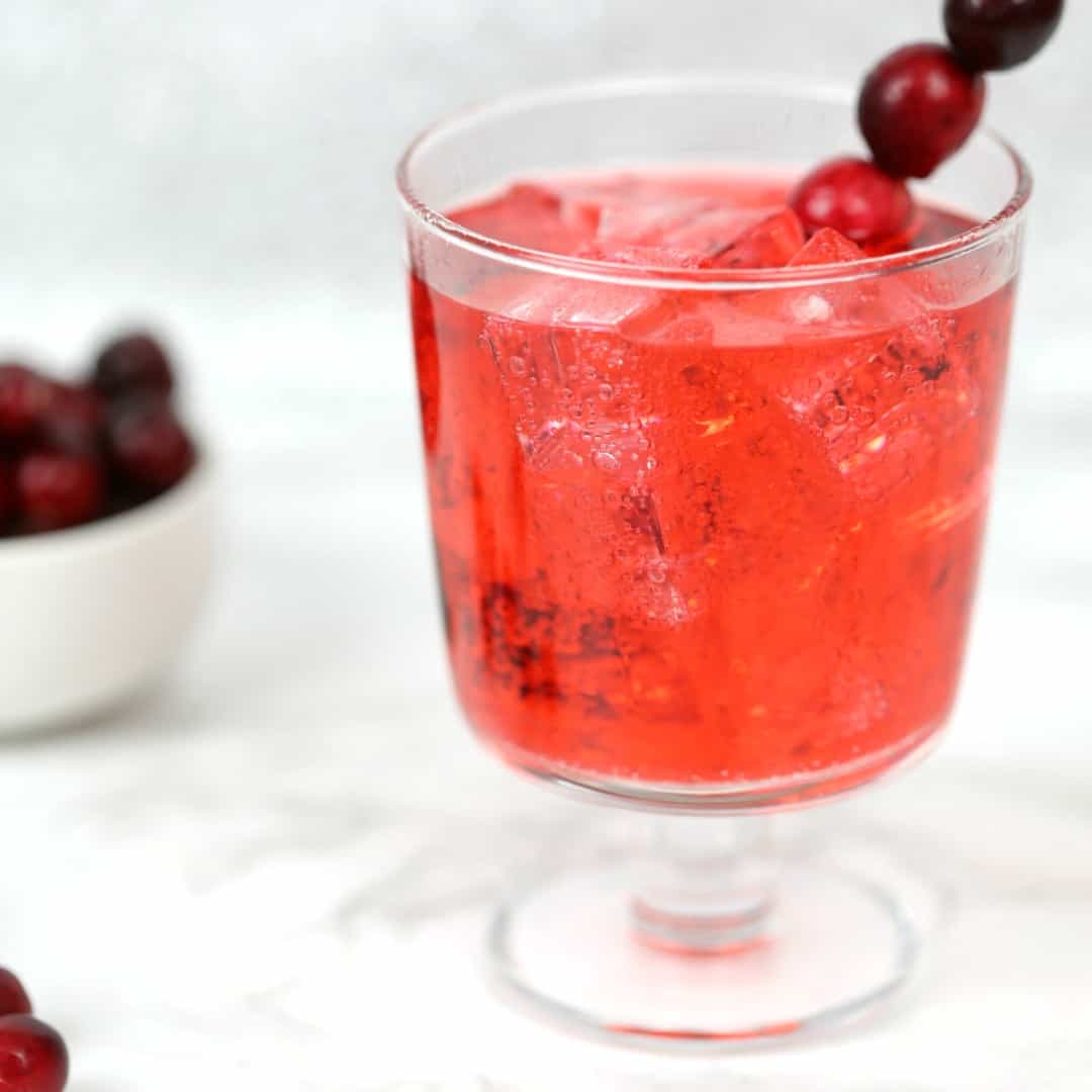 This Cranberry Ginger Fizz Cocktail is a bright combination of the cranberry flavor I love with a hint of ginger for a holiday cocktail you can't beat!