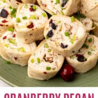 cranberry pecan chicken salad pinwheels on a plate with recipe name at the bottom
