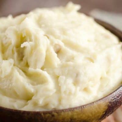 Cream Cheese Garlic Mashed Potatoes are a rich and hearty family favorite! This side dish is a delicious 3 ingredient recipe perfect for a holiday meal or a Sunday dinner!