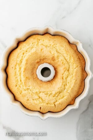 baked cream cheese pound cake in a bundt cake pan