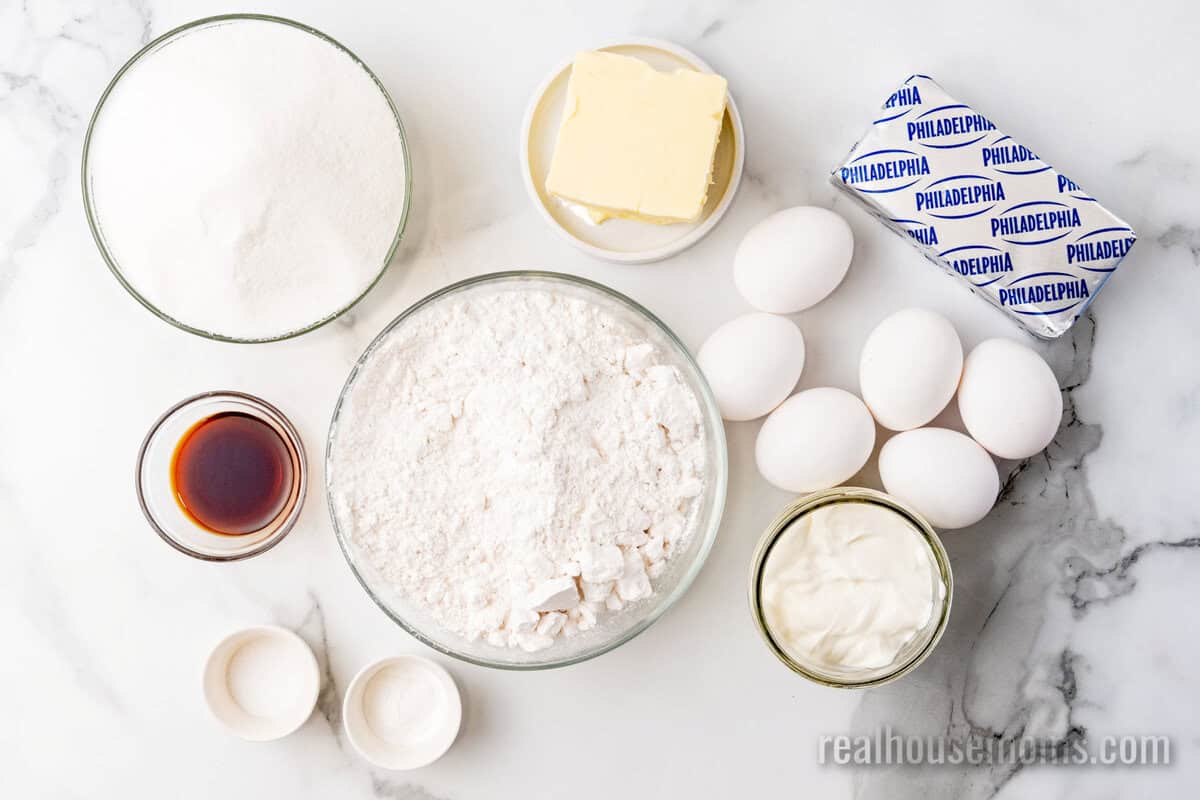 ingredients to make cream cheese pound cake laid out on a counter